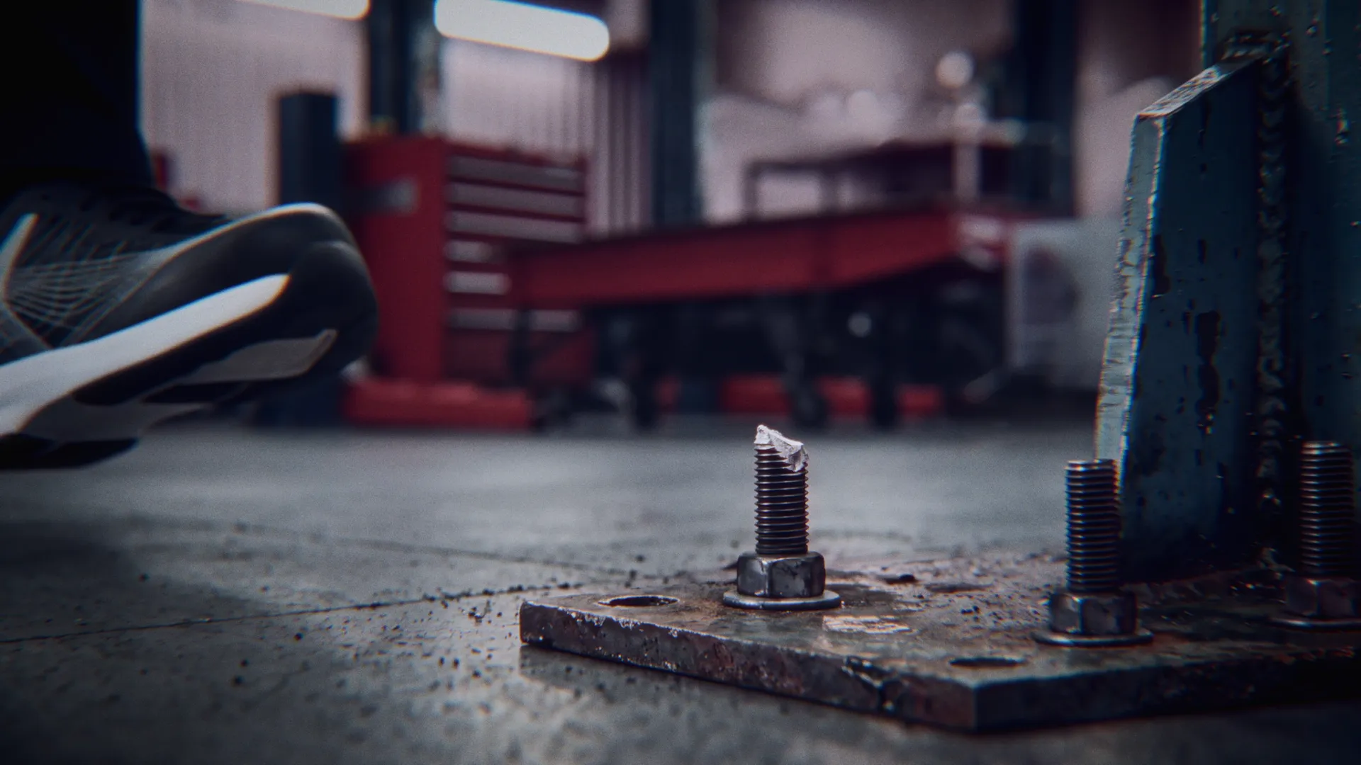 A FEATHER shoe passes a protruding bolt on the vehicle workshop floor